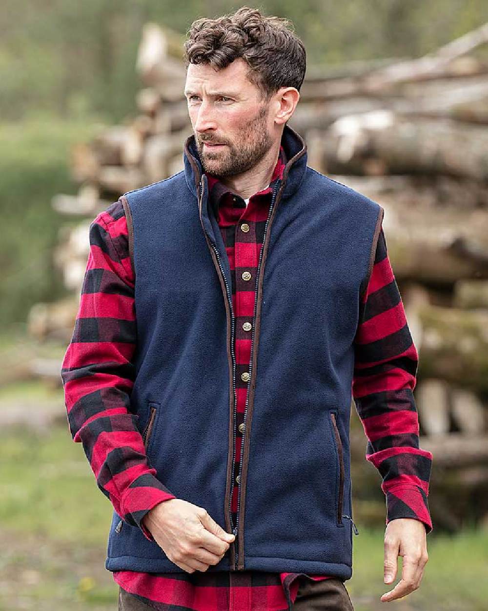 Navy Coloured Hoggs of Fife Woodhall Fleece Gilet on wood background
