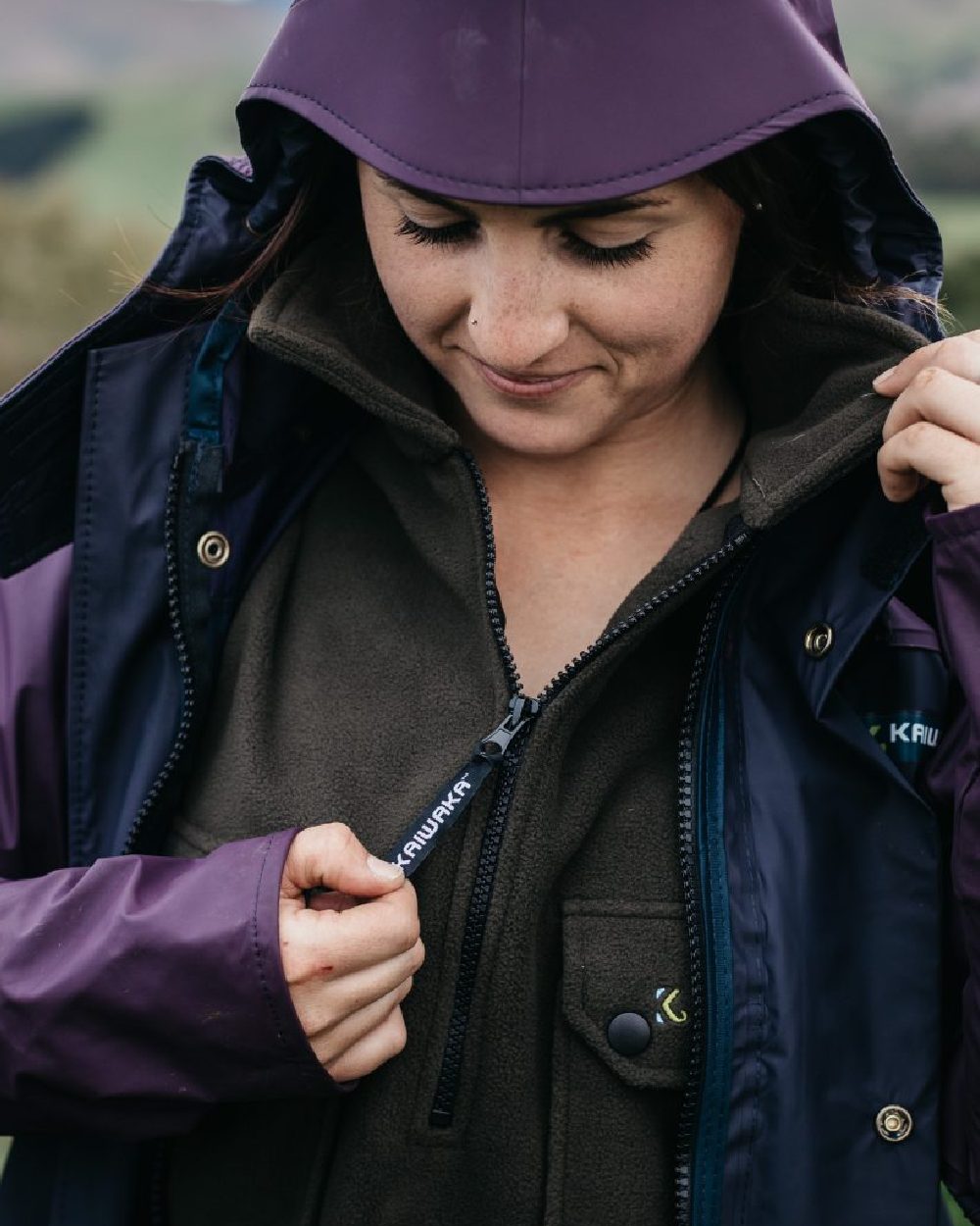 Navy coloured Kaiwaka Womens Lady of the Land AgTex Parka on blurry background