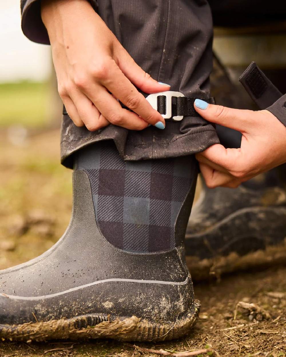 Black Coloured Line 7 Womens Territory Storm Pro20 Waterproof Bib Overtrouser on ground background