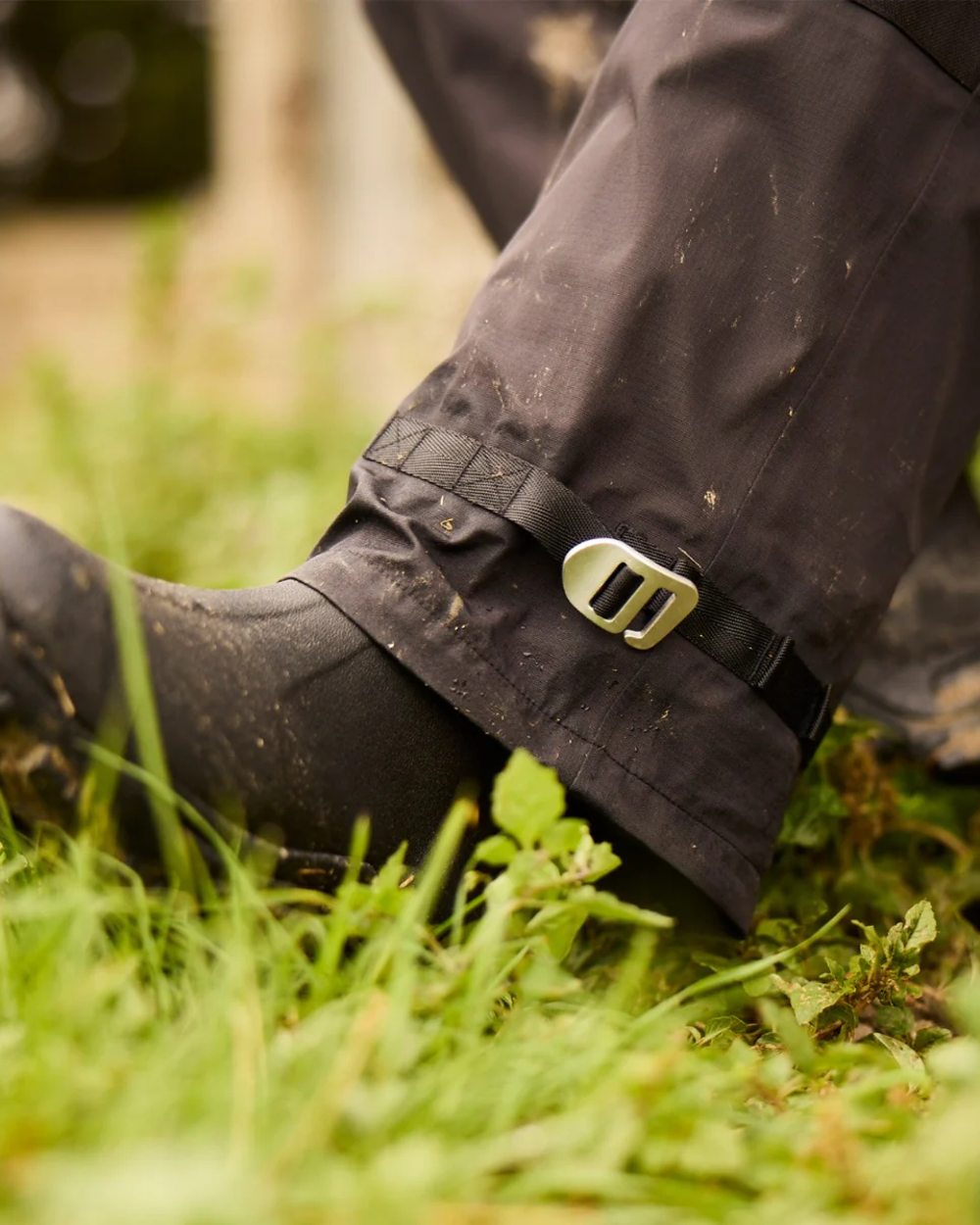 Black coloured Line 7 Womens Territory Storm Pro20 Waterproof Overtrouser on farm background