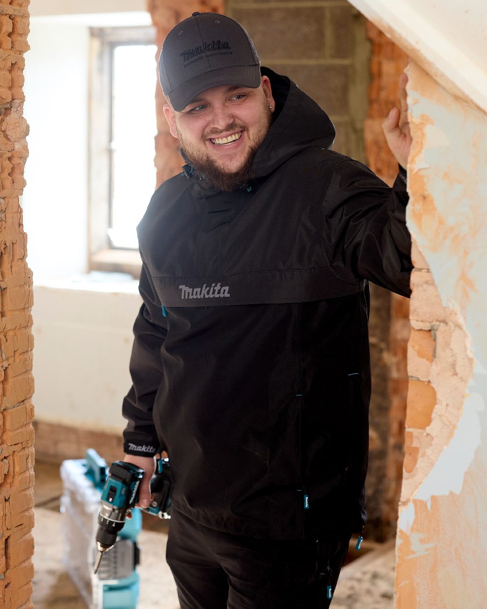 Grey Coloured Makita Mens Aero Jacket on indoor background