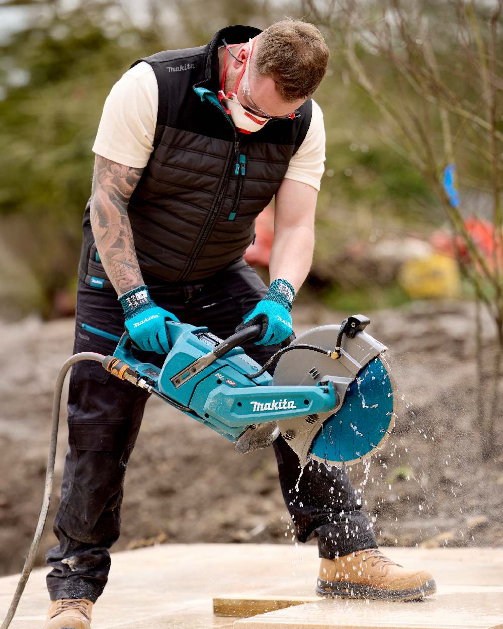 Grey Coloured Makita Mens Shield Bodywarmer on outdoor background