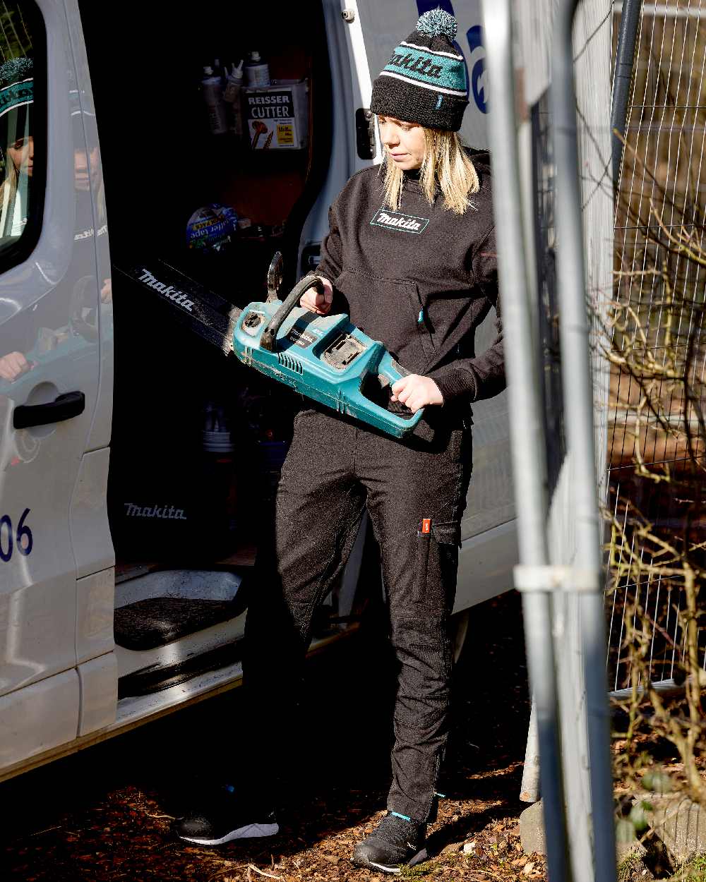 Black Coloured Makita Womens Axis Stretch Joggers on construction background