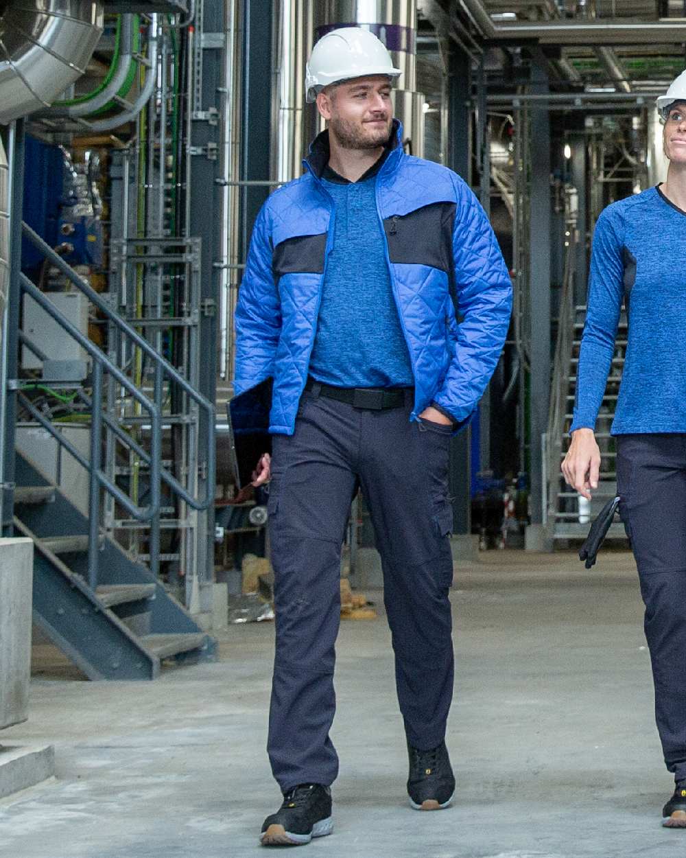 Azure Blue Dark Navy Coloured Mascot Workwear Mens Accelerate Lightweight Thermal Jacket on factory background