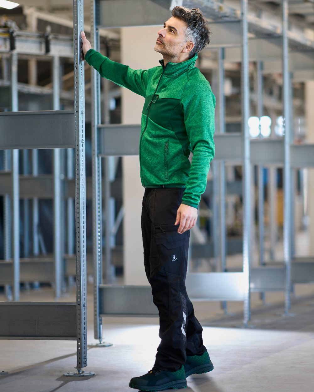 Black Coloured Mascot Workwear Mens Accelerate Stretch Zones Trousers on construction background