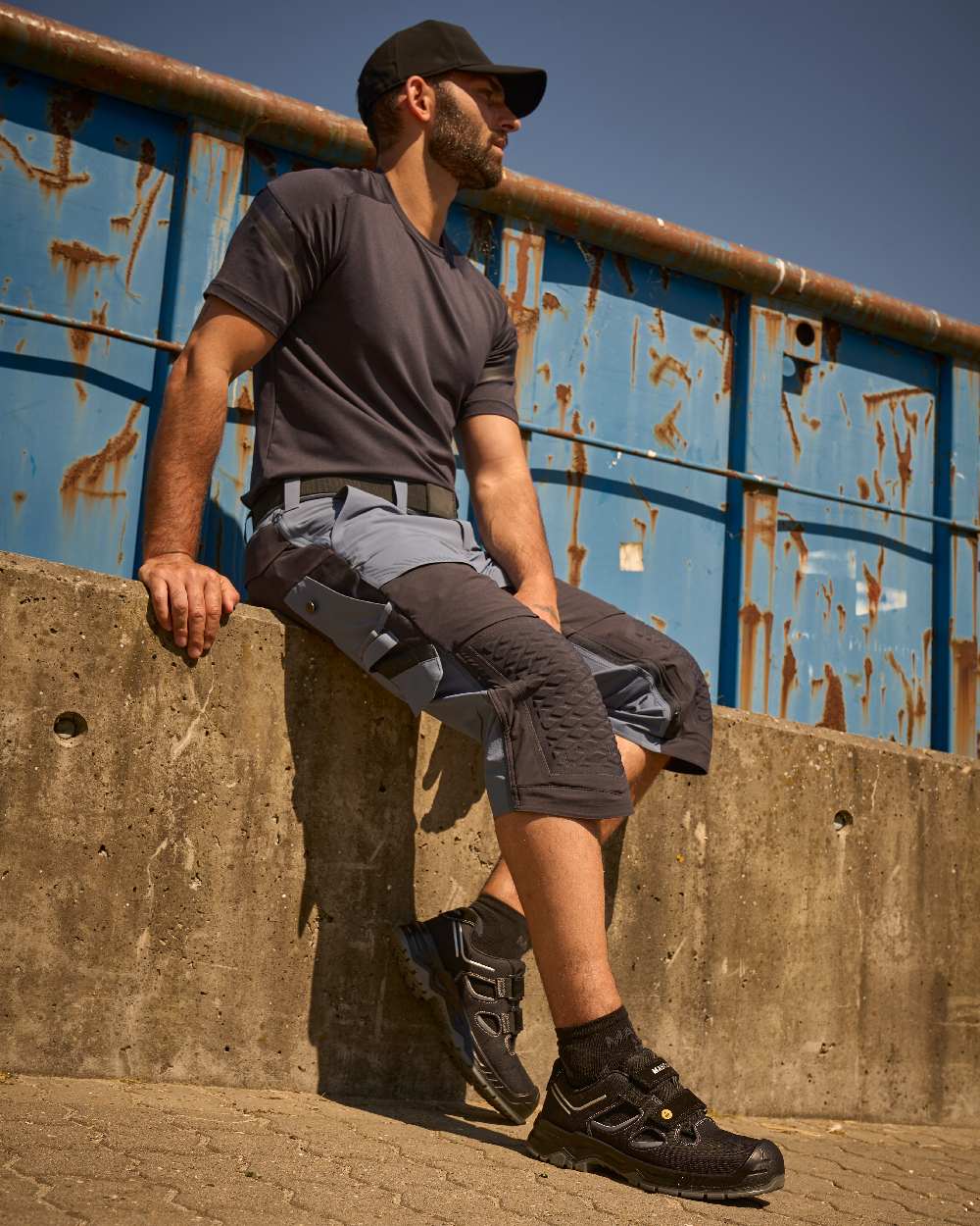 Stone Blue Dark Navy Coloured Mascot Workwear Mens Customized 3/4 Length Trousers With Kneepad Pockets on outdoor background