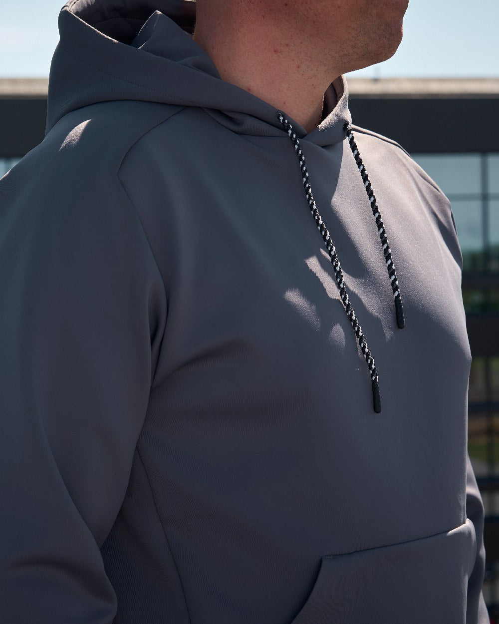 Stone Grey Coloured Mascot Workwear Mens Customized Fleece Hoodie on outdoor background