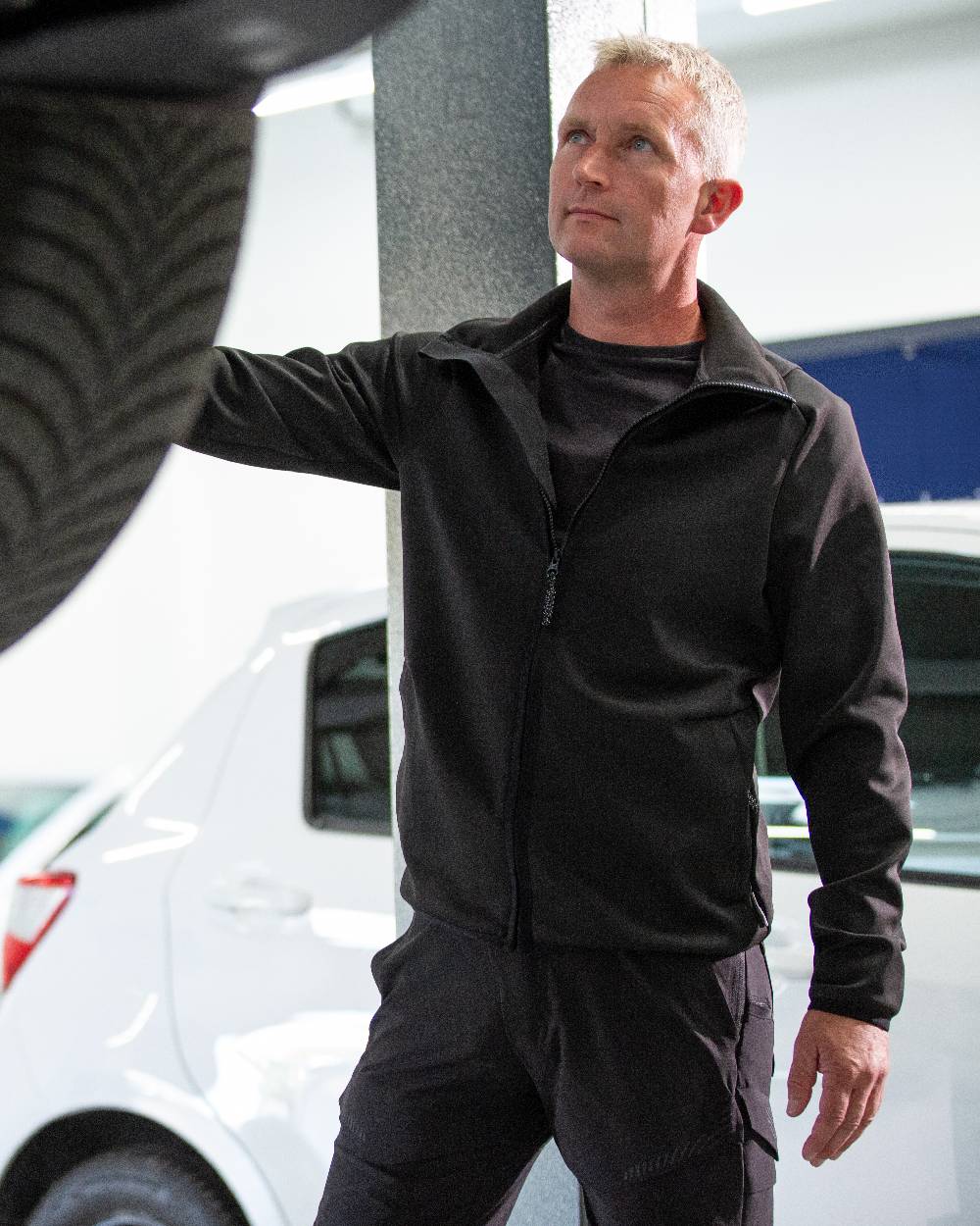 Black Coloured Mascot Workwear Mens Customized Full Zip Fleece Jumper on garage background