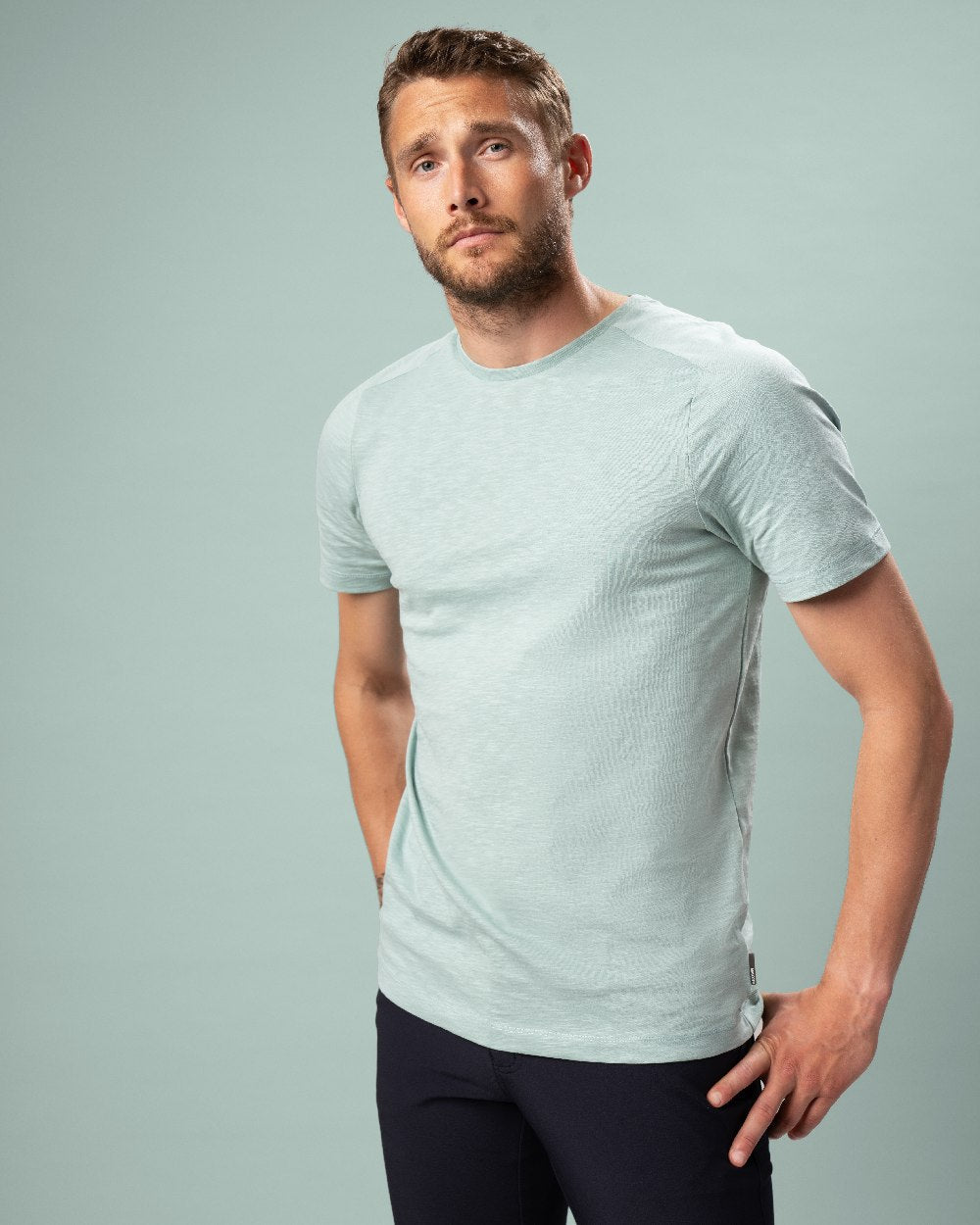 Dusty Green Coloured Mascot Workwear Mens Customized Premium Short Sleeve T-Shirt on studio background
