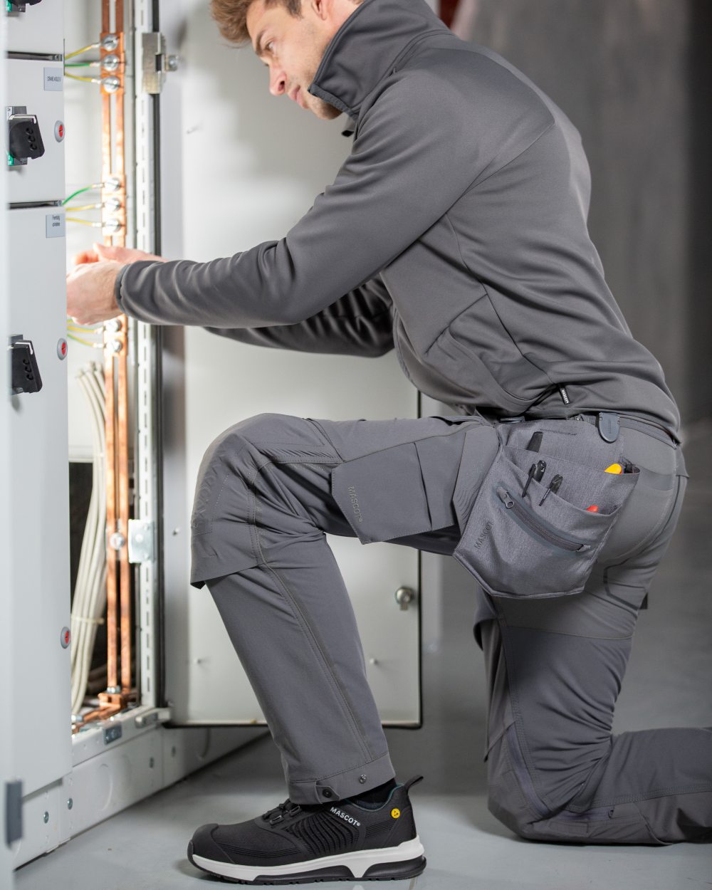 Stone Grey Coloured Mascot Workwear Mens Customized Ultimate Stretch Trousers on indoor background