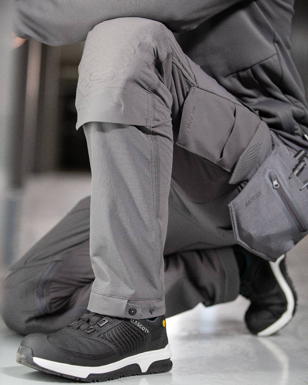 Stone Grey Coloured Mascot Workwear Mens Customized Ultimate Stretch Trousers on indoor background