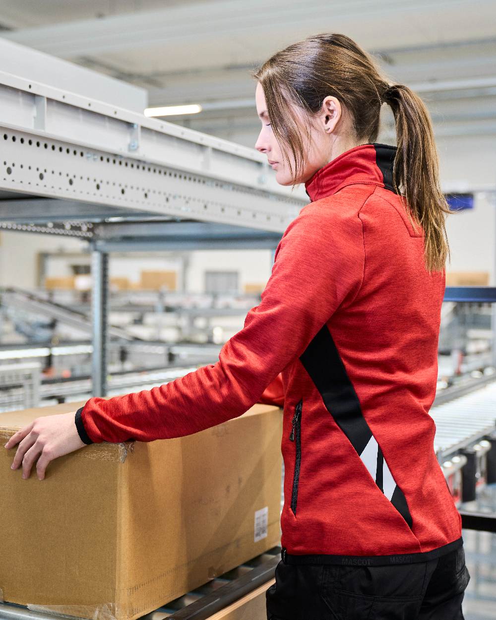 Traffic Red Black Coloured Mascot Workwear Womens Accelerate Fleece Jumper With Zipper on warehouse background