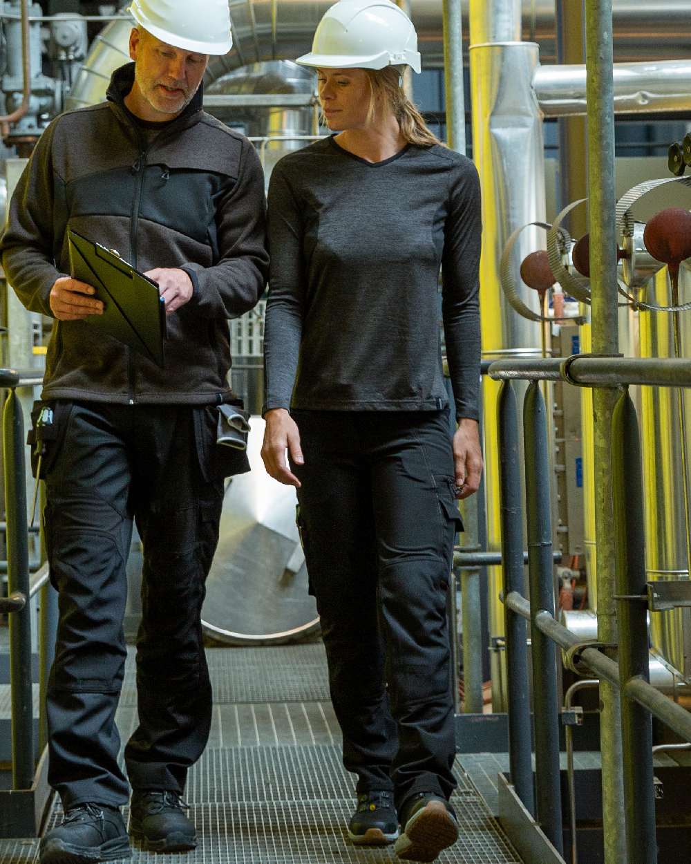 Black Coloured Mascot Workwear Womens Accelerate Trousers With Kneepad Pockets on factory background