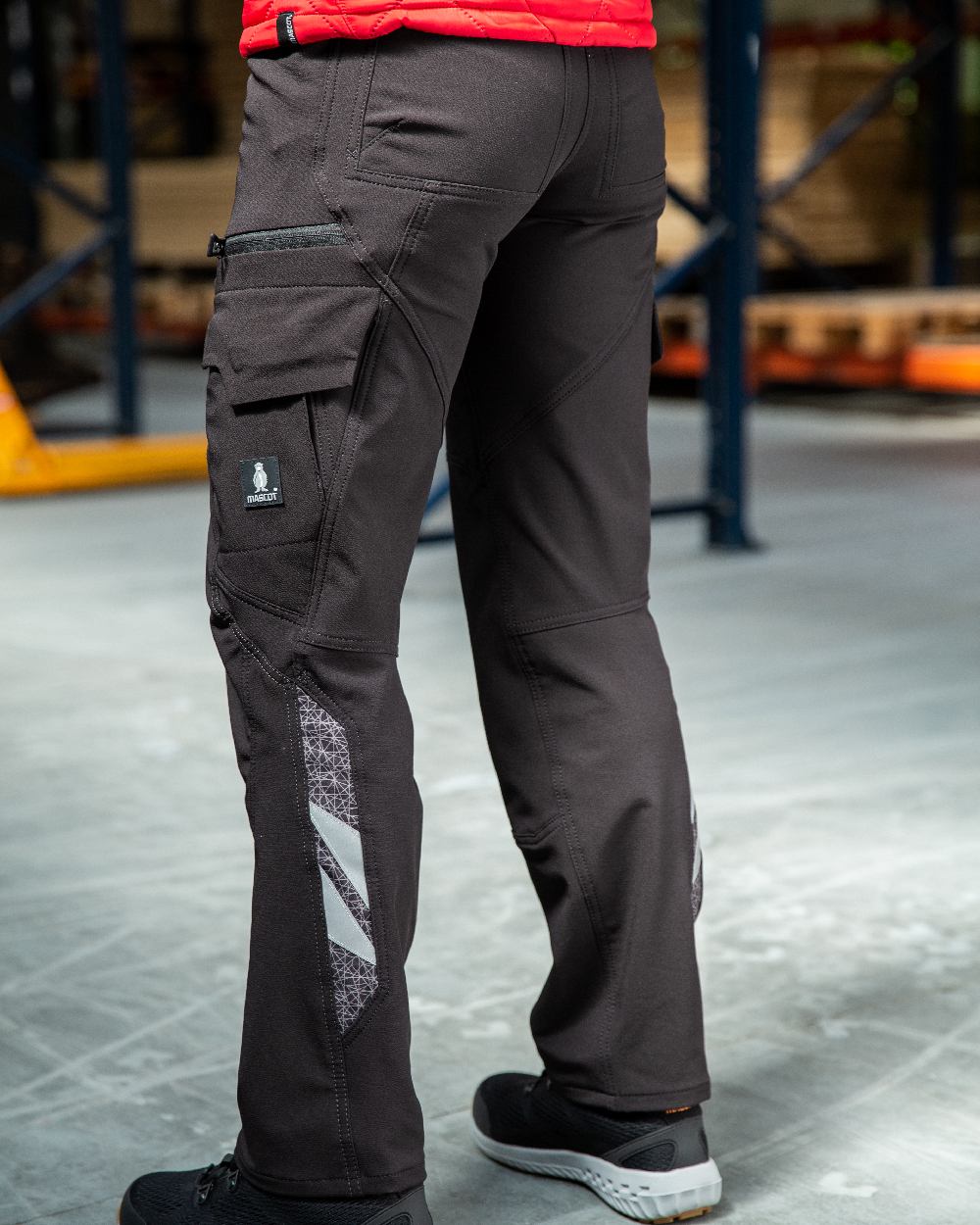 Black Coloured Mascot Workwear Womens Accelerate Trousers With Thigh Pockets on warehouse background