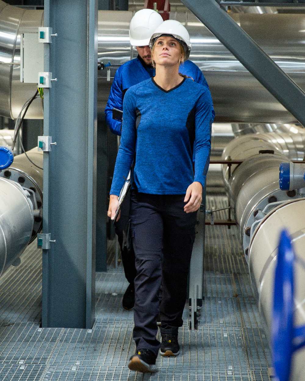 Dark Navy Coloured Mascot Workwear Womens Accelerate Ultimate Stretch Trousers on factory background