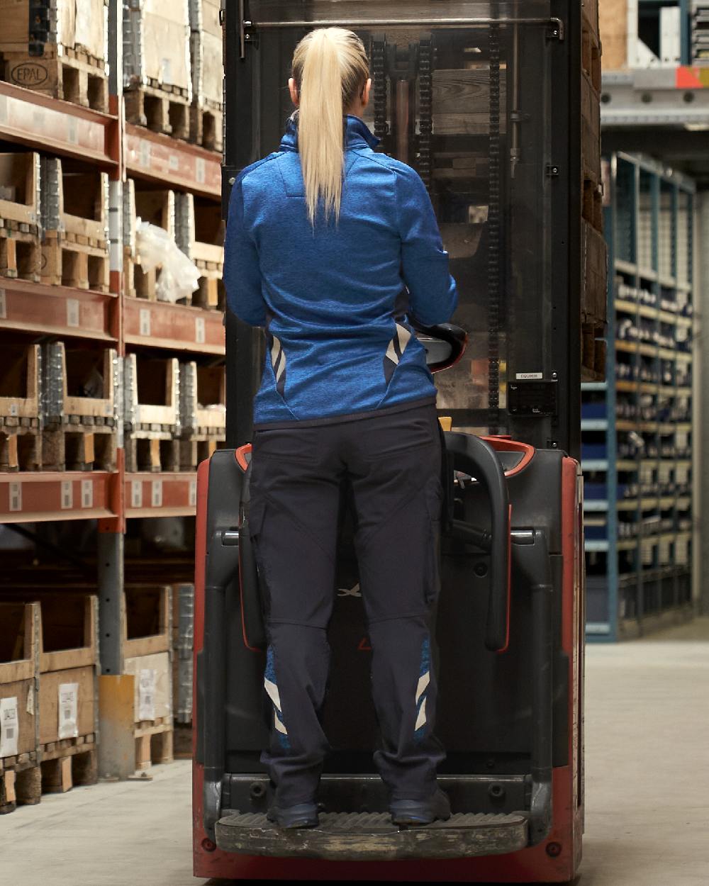 Dark Navy Coloured Mascot Workwear Womens Accelerate Ultimate Stretch Trousers on factory background