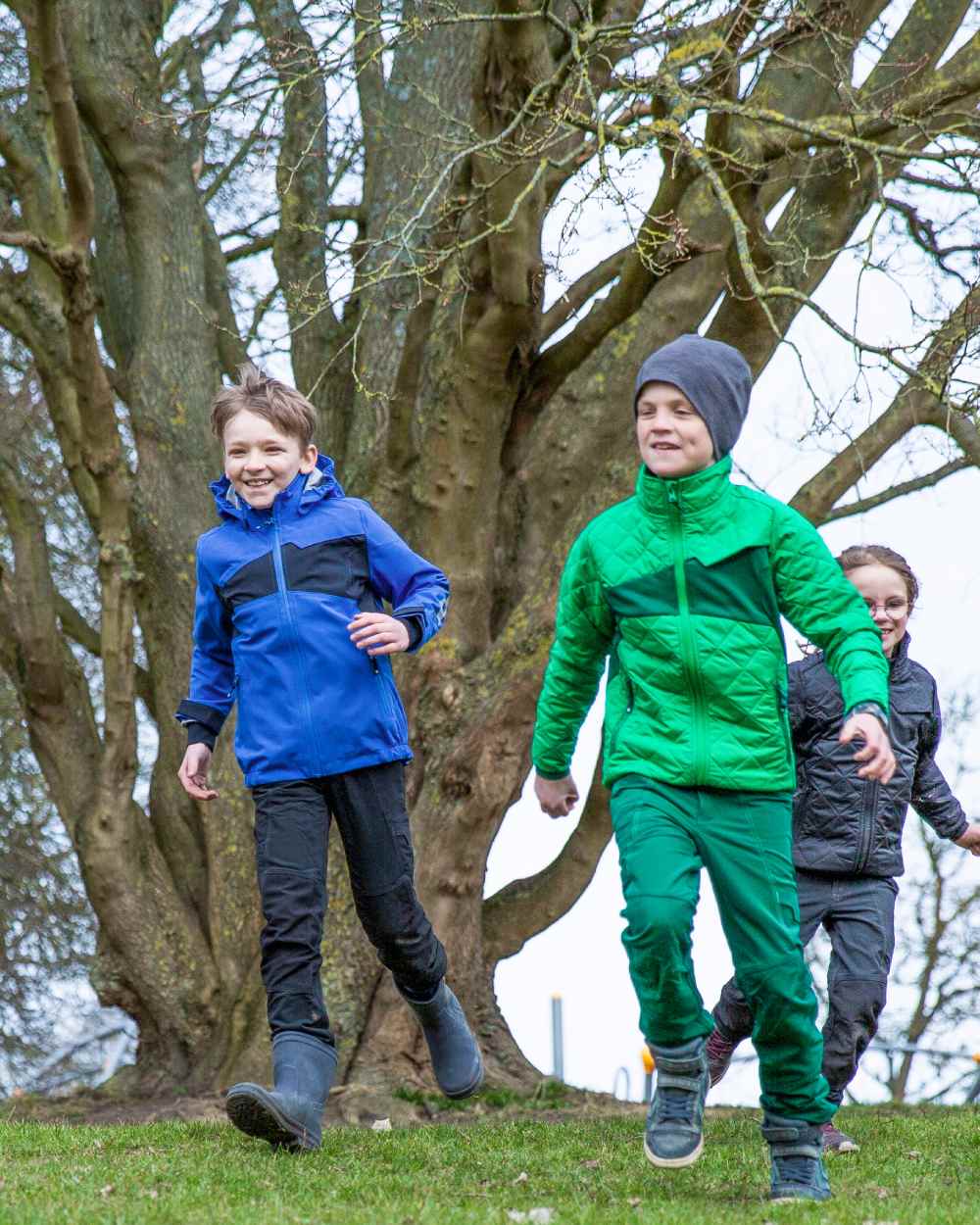 Azure Blue Dark Navy coloured Mascot Workwear Childrens Accelerate Water Repellent Jacket on park background