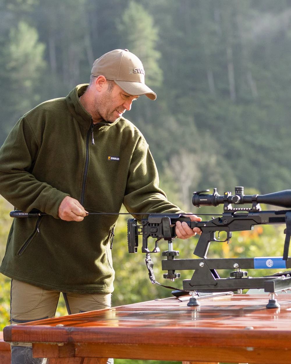 Olive Coloured Swazi Doughroaster on forest background