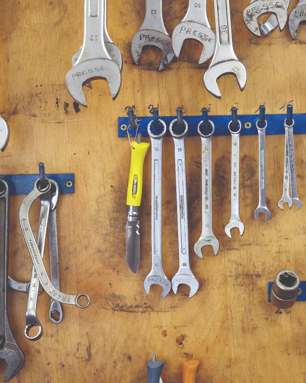 Yellow coloured Opinel No.9 DIY Knife on workstation background