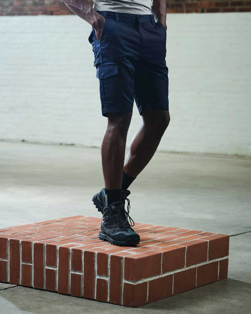 Navy coloured Regatta Pro Cargo Shorts on blurry background
