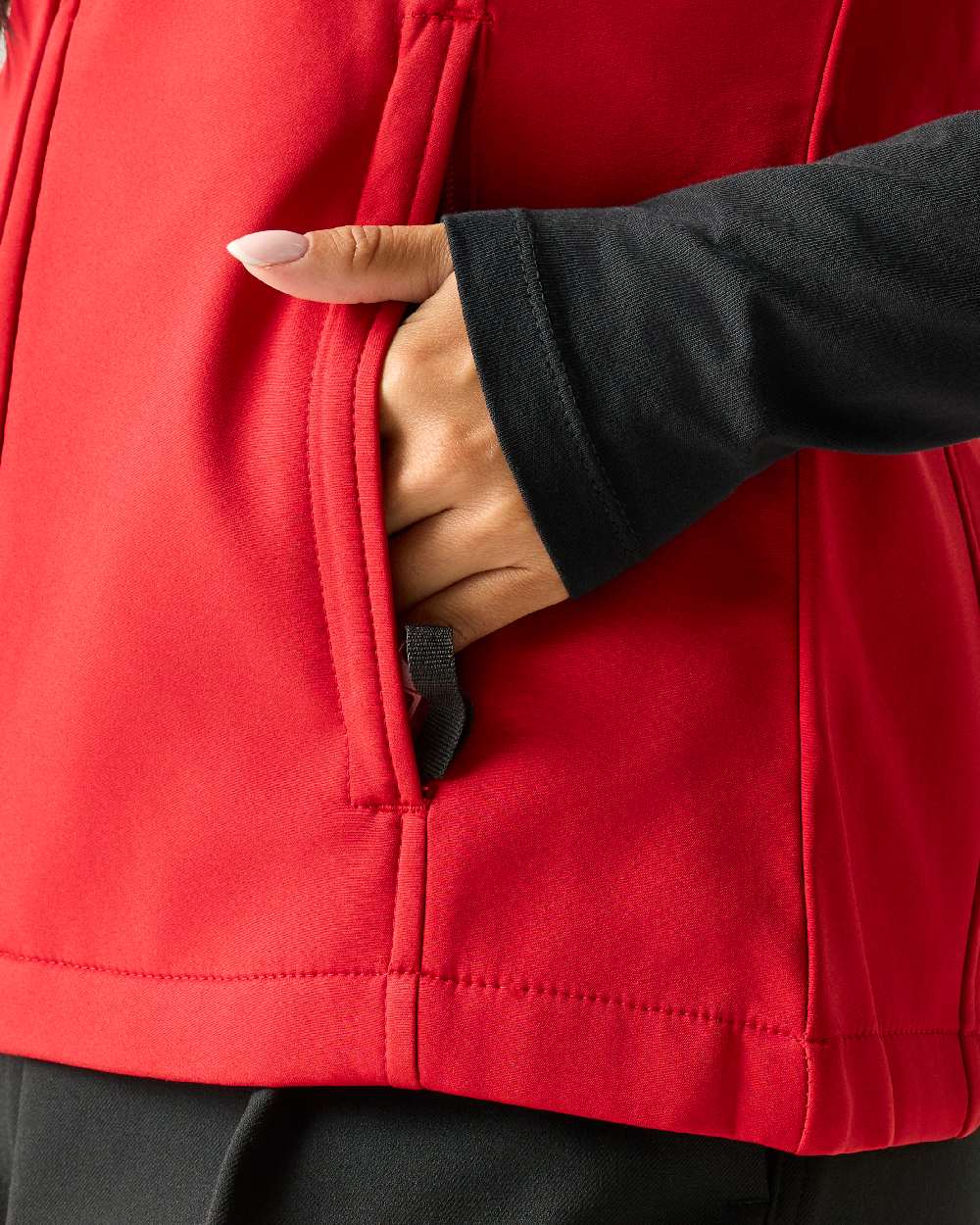 Classic Red coloured Regatta Professional Womens Flux Softshell Bodywarmer on beige background