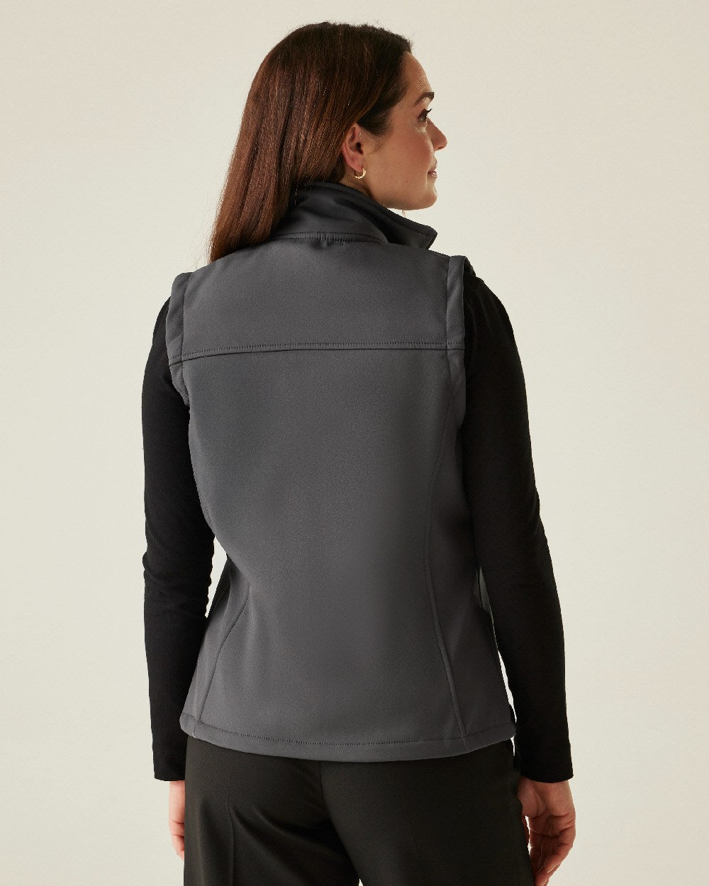Seal Grey coloured Regatta Professional Womens Flux Softshell Bodywarmer on beige background