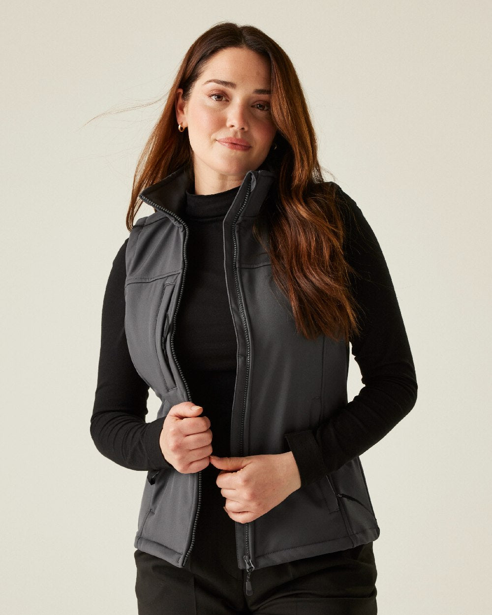 Seal Grey coloured Regatta Professional Womens Flux Softshell Bodywarmer on beige background