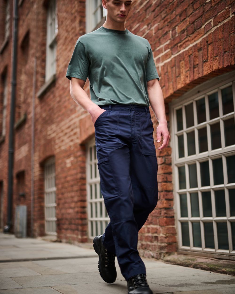 Navy coloured Regatta Mens Multi Pocket Action Trousers Short Leg on street background