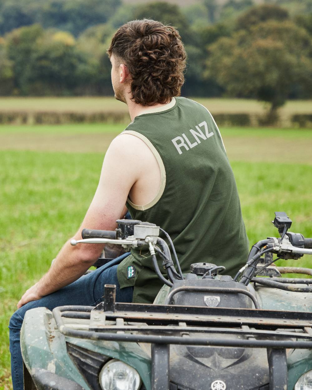 Olive Multi coloured Ridgeline Backslider Singlet Top on forest background