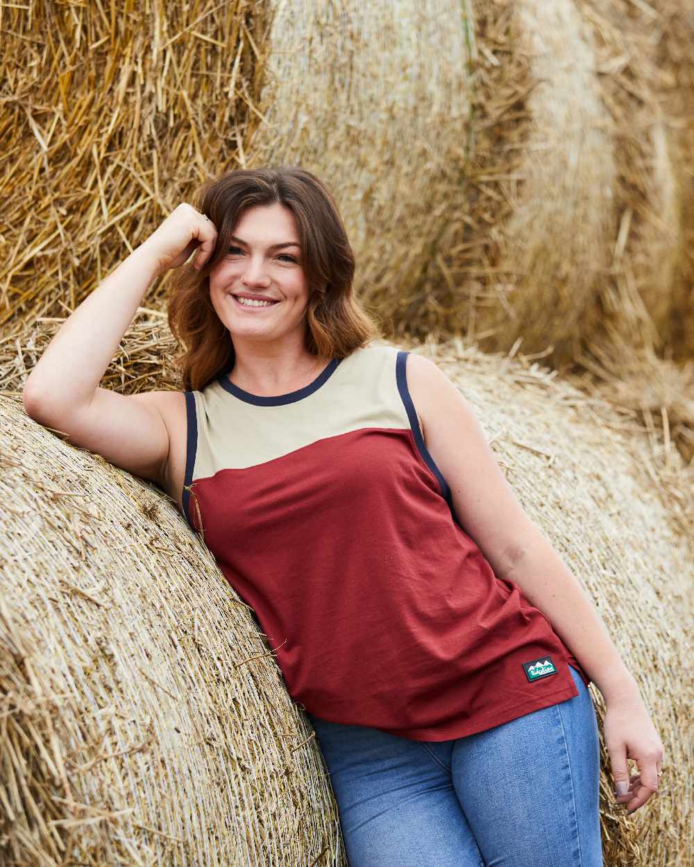 Rhubarb Multi coloured Ridgeline Backslider Singlet Top on haystack background