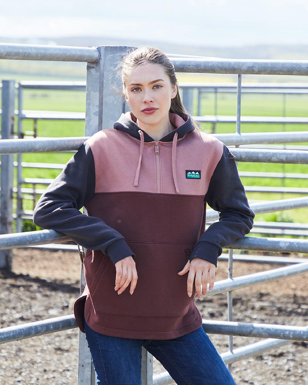 Oxblood coloured Ridgeline Womens Tribe Hoodie on farm background
