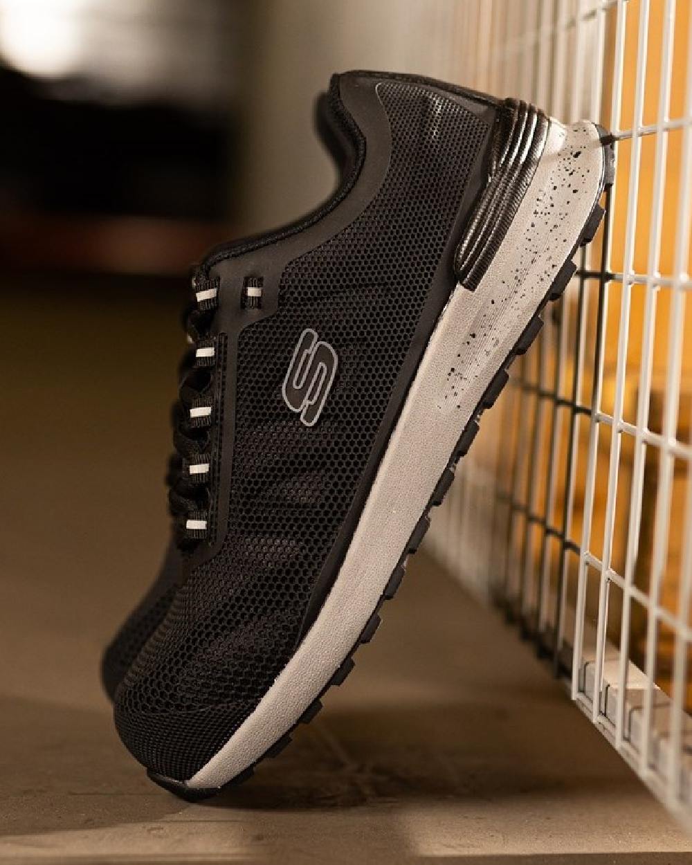 Black Coloured Skechers Workwear Mens Bulklin Bragoo Safety Trainers on indoor background