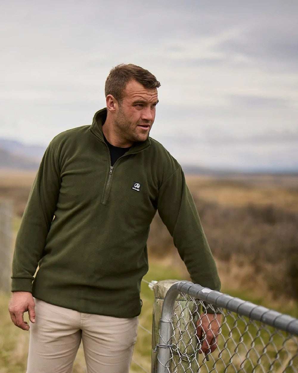 Olive Coloured Swanndri Mens Motu Fleece Pullover on forest background