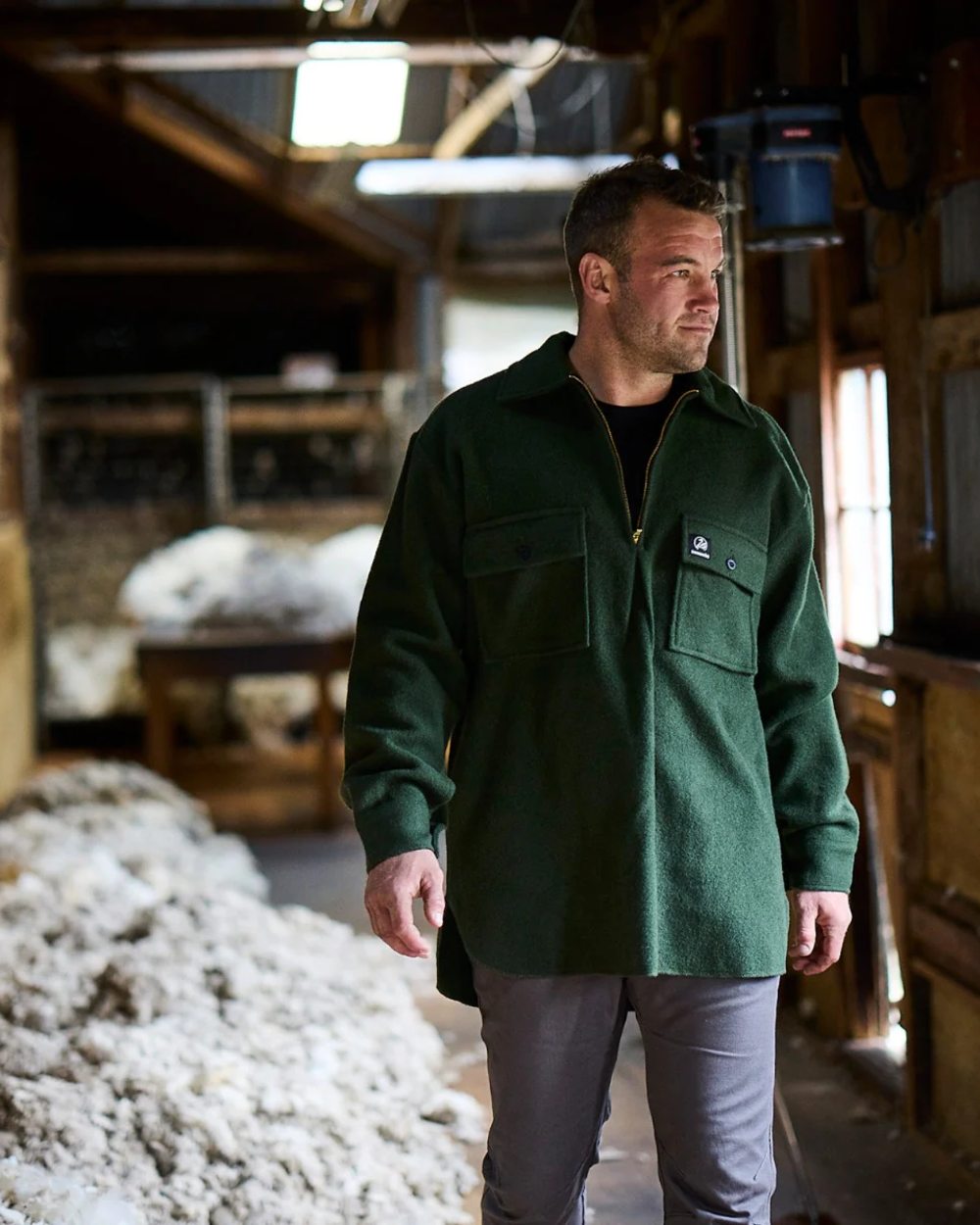 Olive Coloured Swanndri Mens Ranger Wool Zip Front Bushshirt on factory background