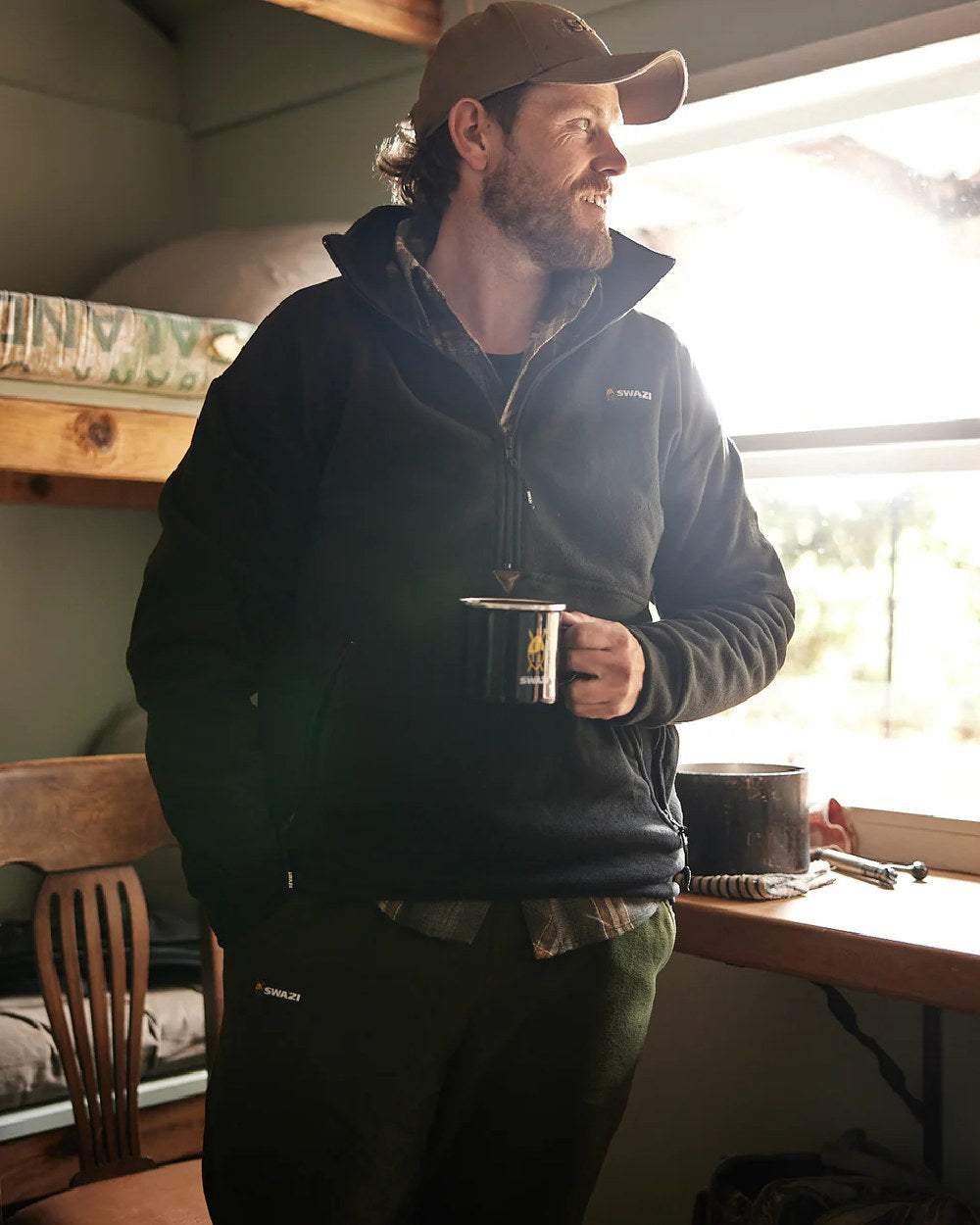 Black Coloured Swazi Doughroaster on wood background