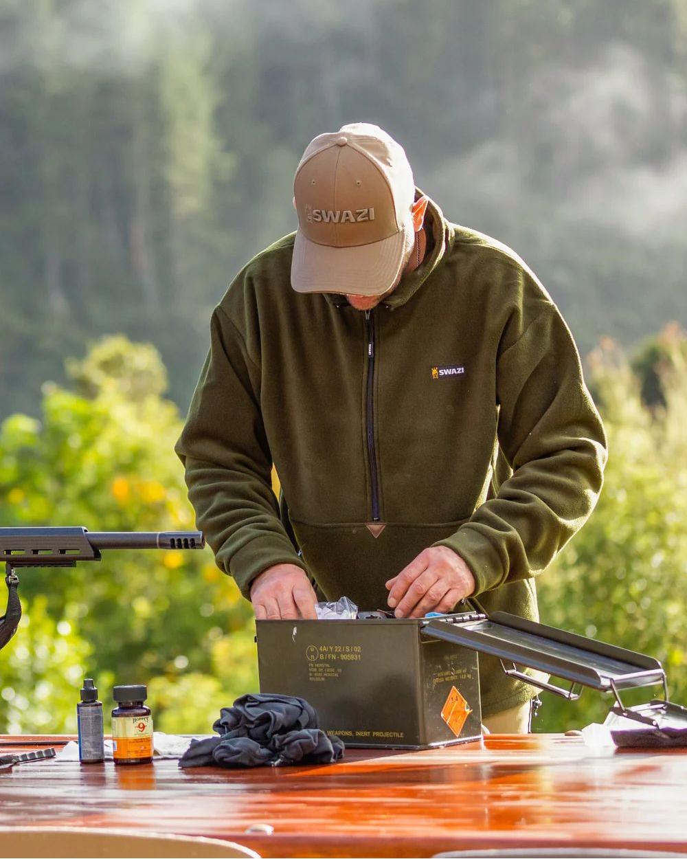 Olive Coloured Swazi Doughroaster on forest background