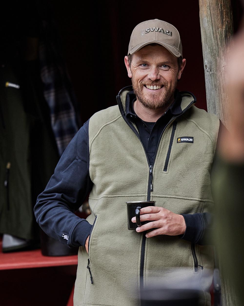 Tussock Coloured Swazi Sherpa Vest on blurry background