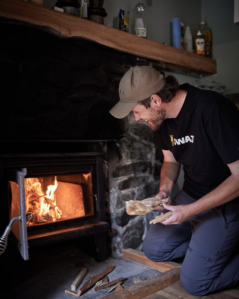 Black Coloured Swazi Tee on room background