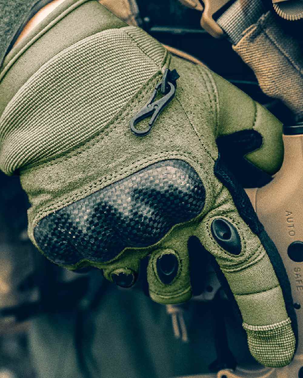 Green Coloured Viper Elite Gloves on blurry background