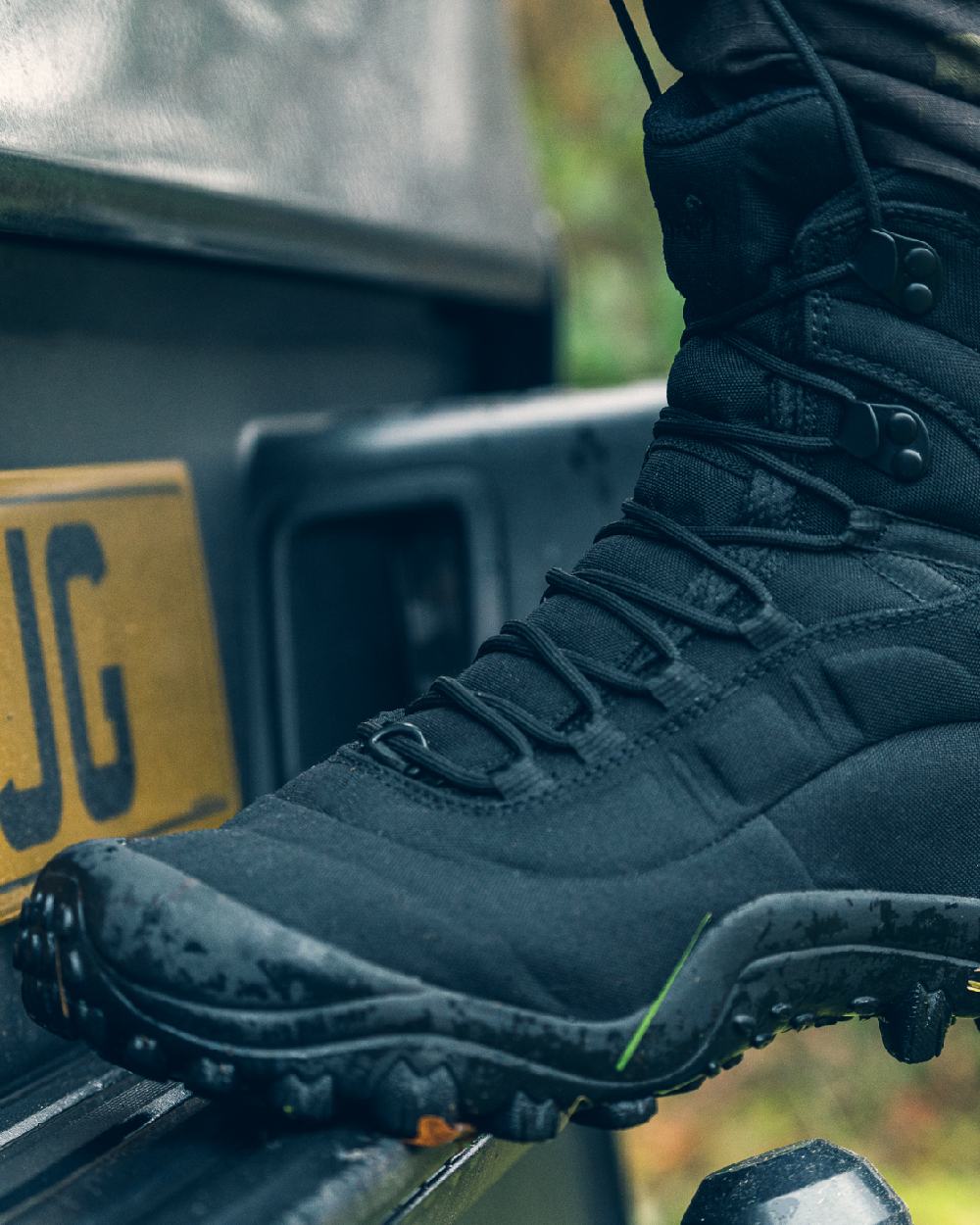 Black Coloured Viper Venom Boots on car background