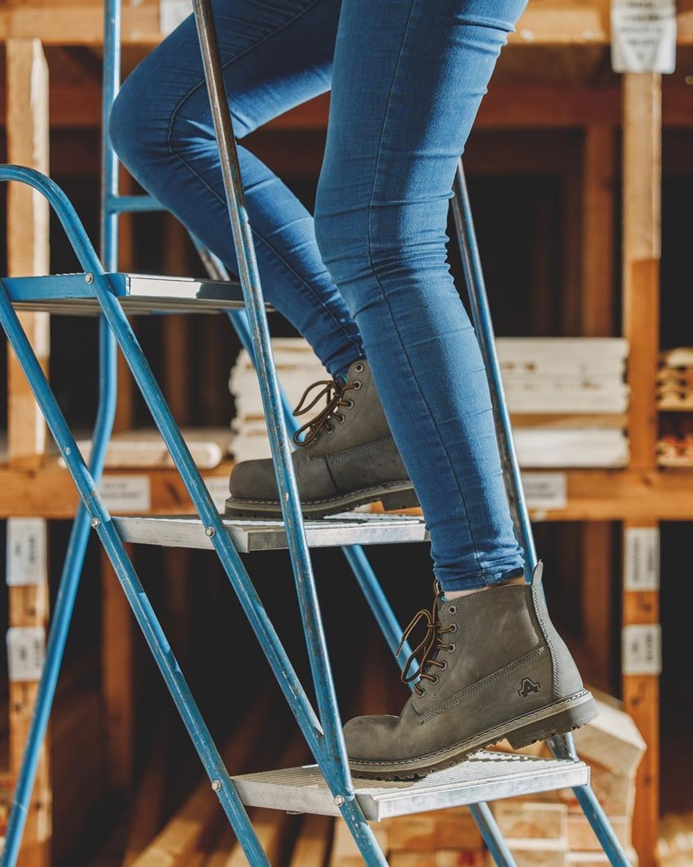 Grey Coloured Amblers Safety AS105 Mimi Safety Boots on work
station background