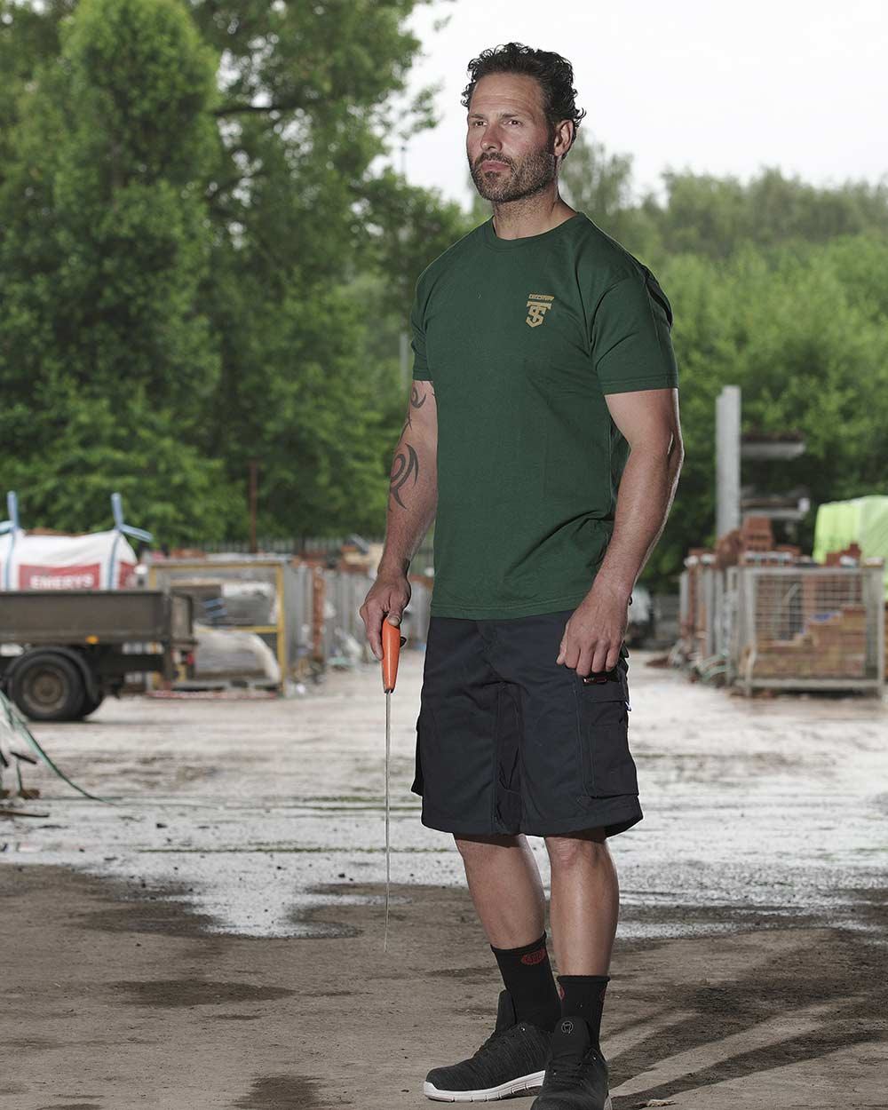 Black Coloured TuffStuff Pro Work Shorts On A Street Background