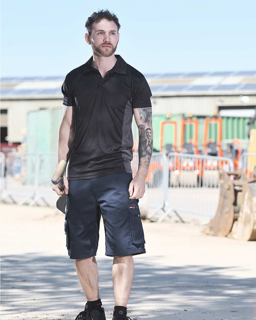 Navy Blue Coloured TuffStuff Pro Work Shorts On A Street Background