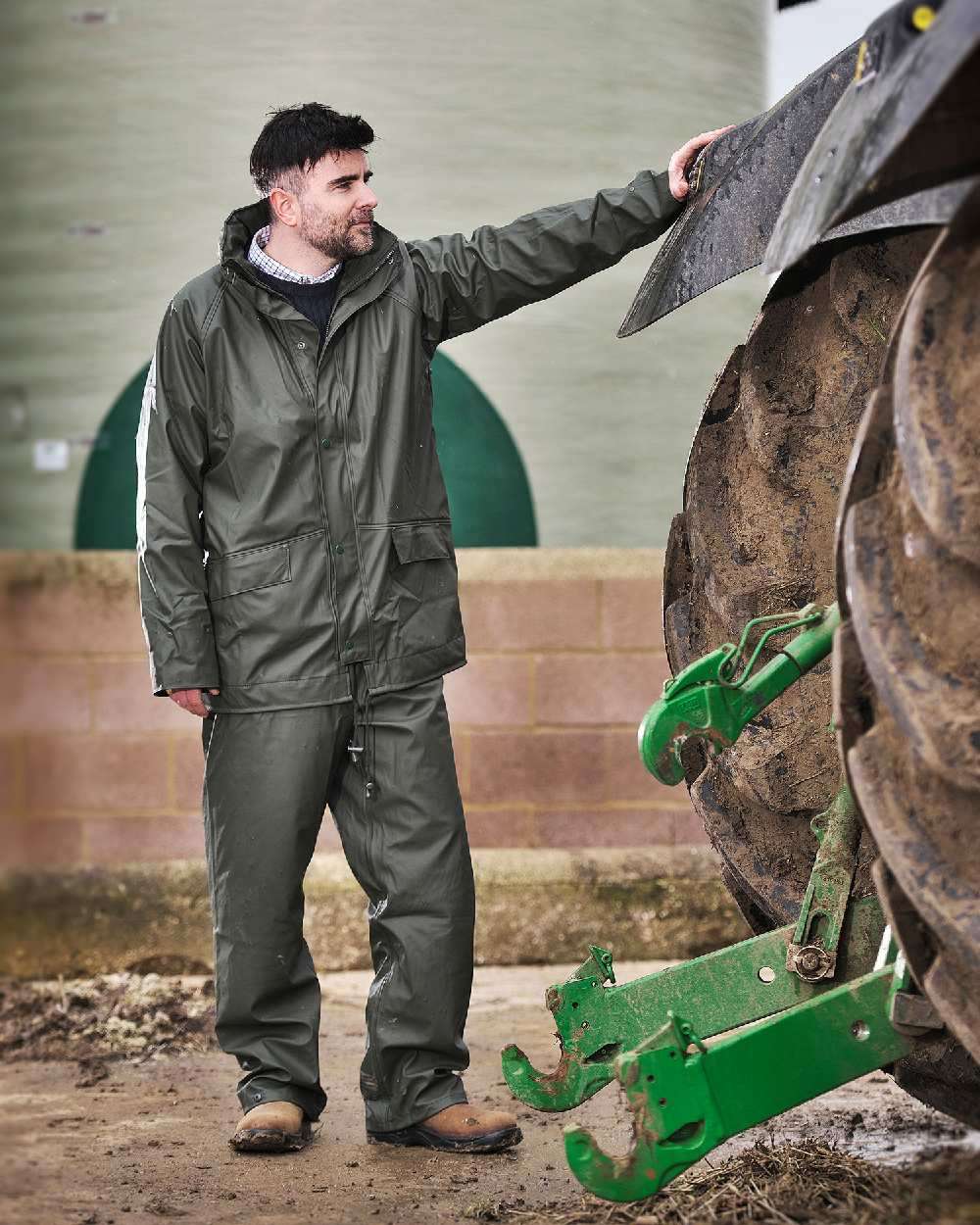 Olive Coloured Fort Airflex Waterproof Breathable Trousers On A Brick Wall Background