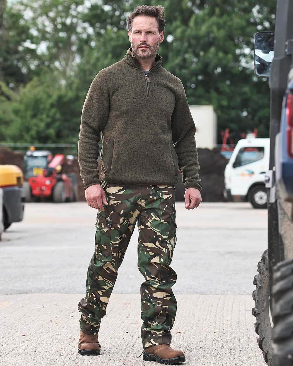 Woodland Coloured Fort Camo Combat Trousers On A Warehouse Background