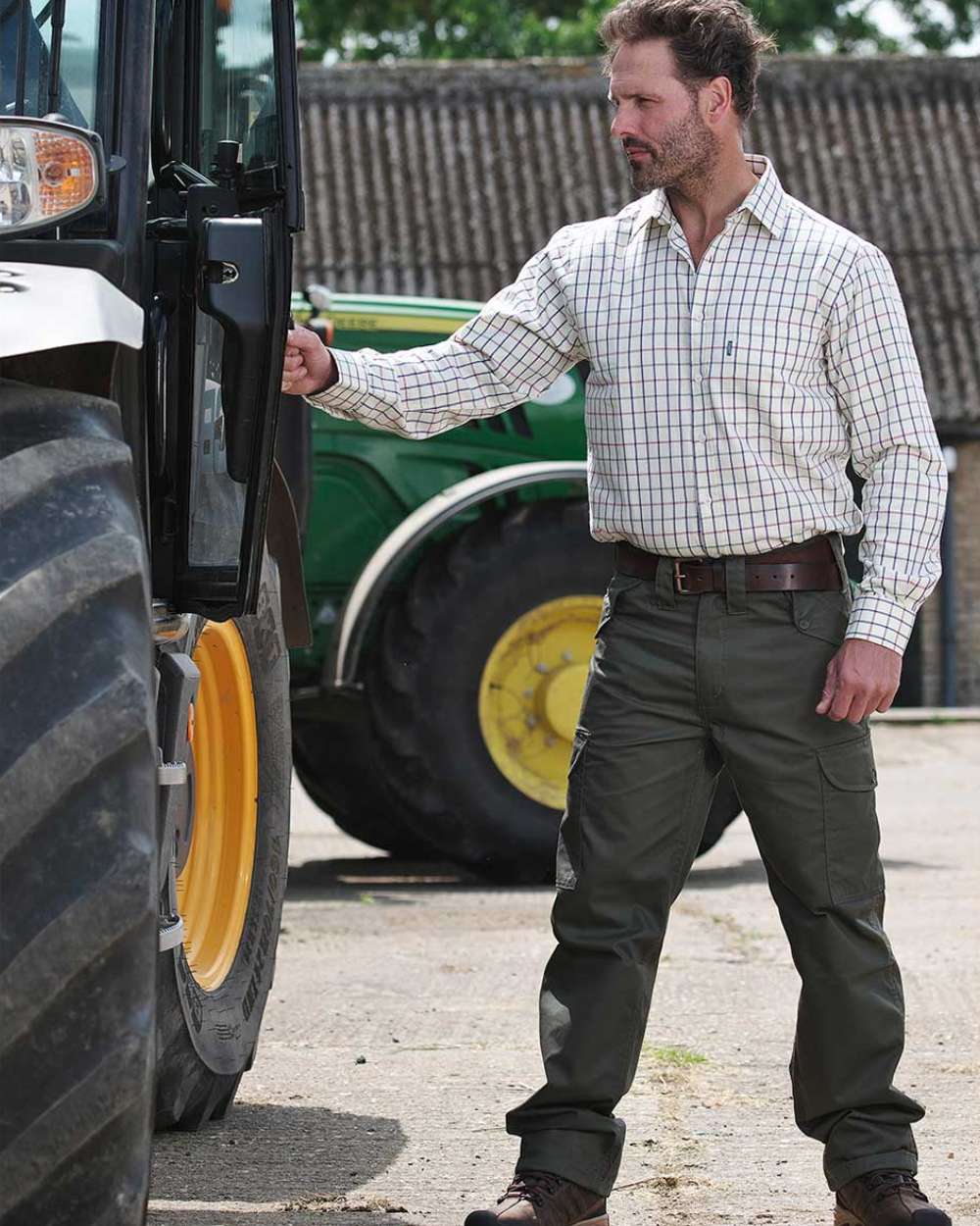 Olive Coloured Fort Combat Trousers On A Farm House Background