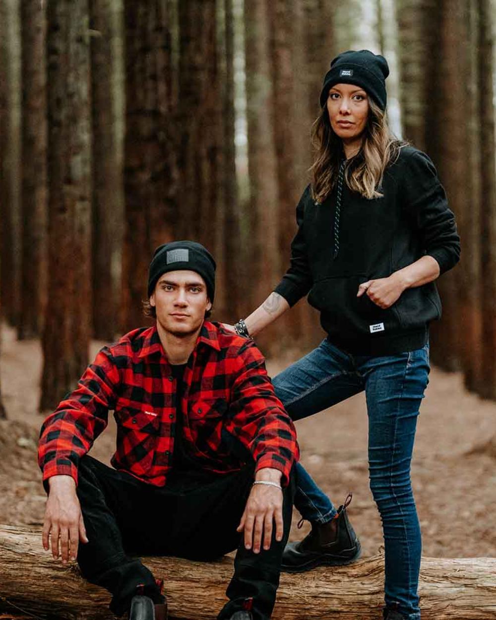 Black Coloured Hard Yakka 3056 Beanie on Forest Background
