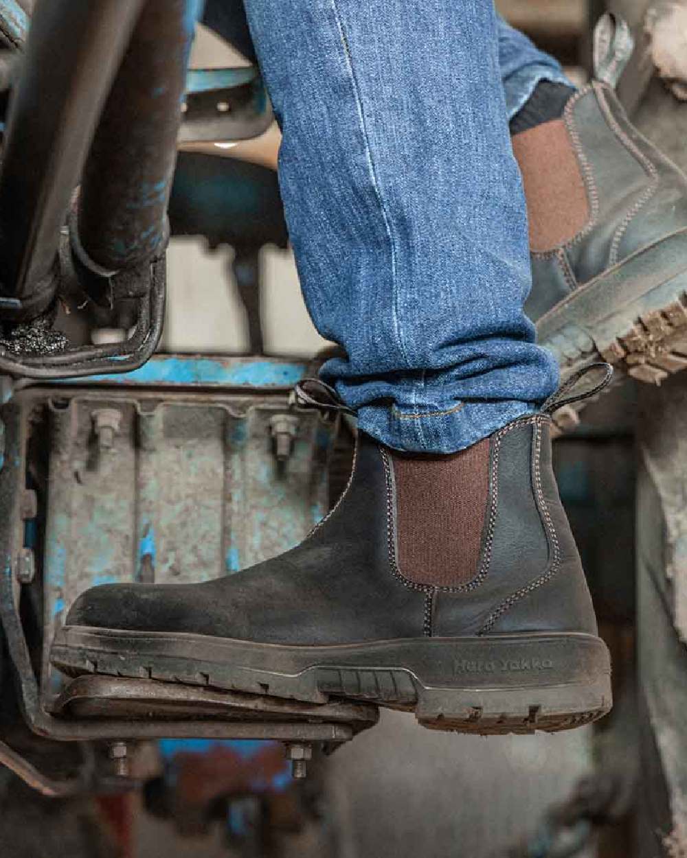 Brown Coloured Hard Yakka Outback Steel Toe Safety Dealer Boots on Outdoor Background