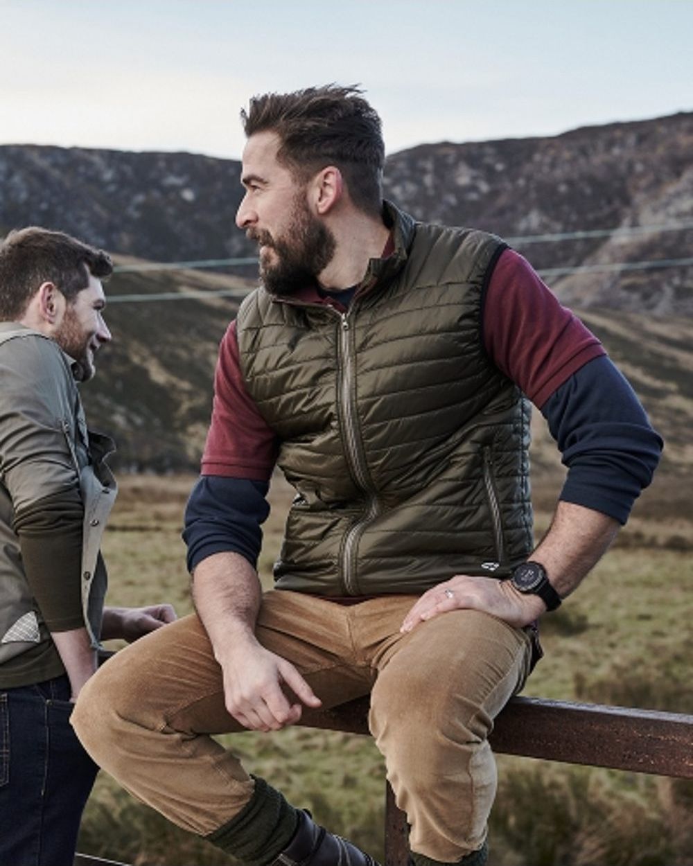 Olive Merlot coloured Hoggs of Fife Kingston Rip-Stop Gilet on mountain background