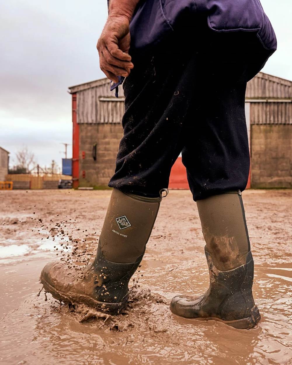 Moss Coloured Muck Boots Arctic Sport Tall Wellingtons On A Shelter Background